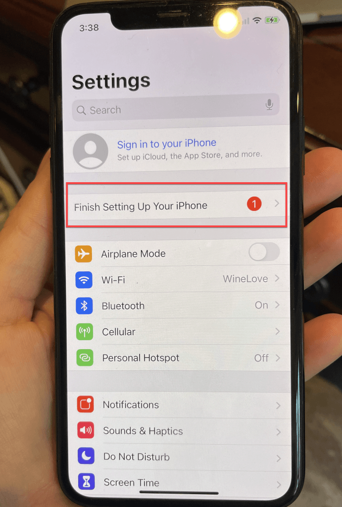 Digital forensics artifacts: Red alert prompts 'Finish Setting Up Your iPhone' observed post device wipe and setup.



