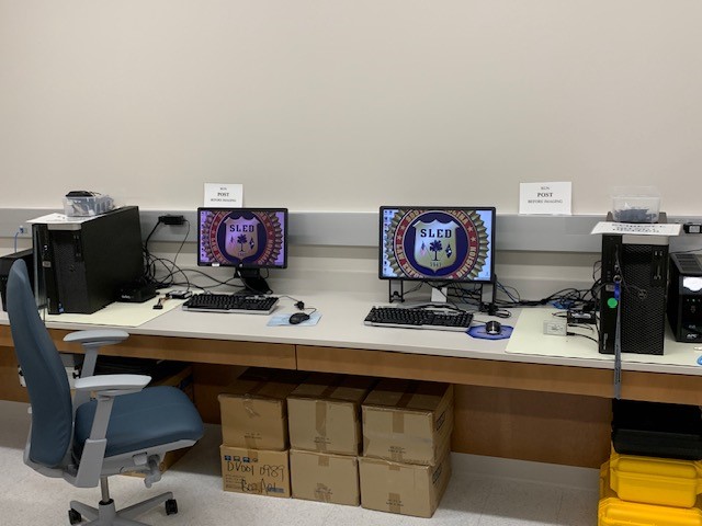 SLED Digital Forensics Lab diligently scrutinizes evidence in a murder case investigation.